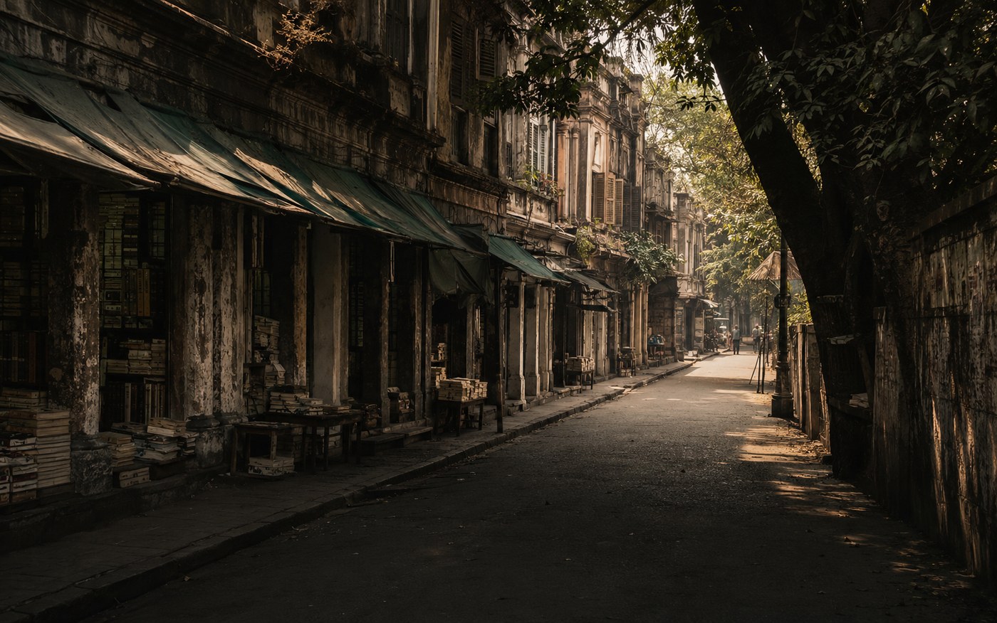 Kolkata old book street with shaded colonial buildings and stacked books